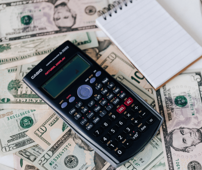 Cash under calculator and note pad