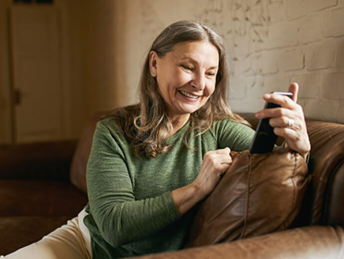 mature woman using mobile phone